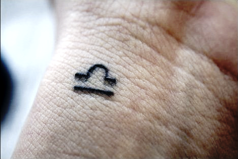 Tiny Libra Wrist Tattoo