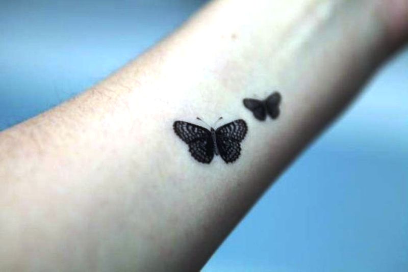 Tiny Two Butterfly Tattoo On Wrist
