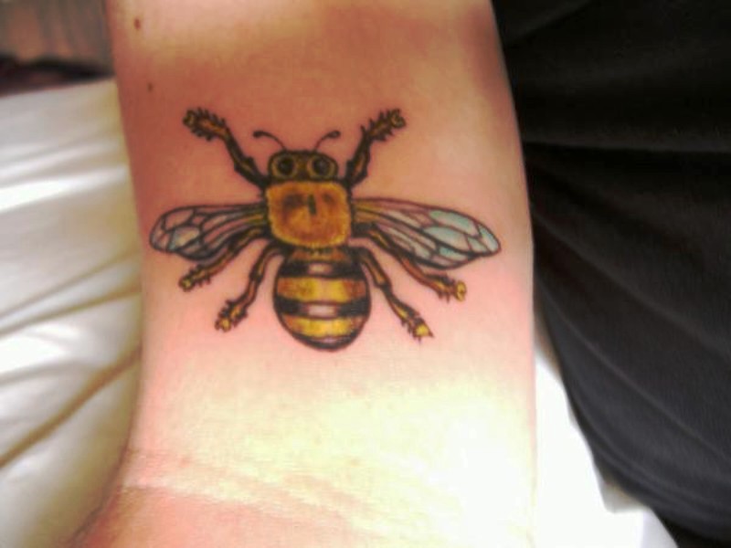 Tremendous Yellow Bee Tattoo On Wrist