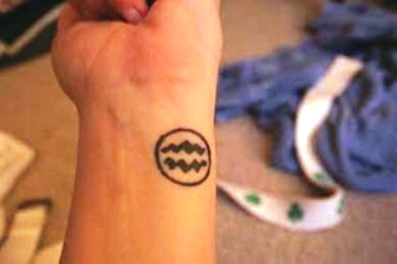 Tribal Aquarius Wrist Tattoo