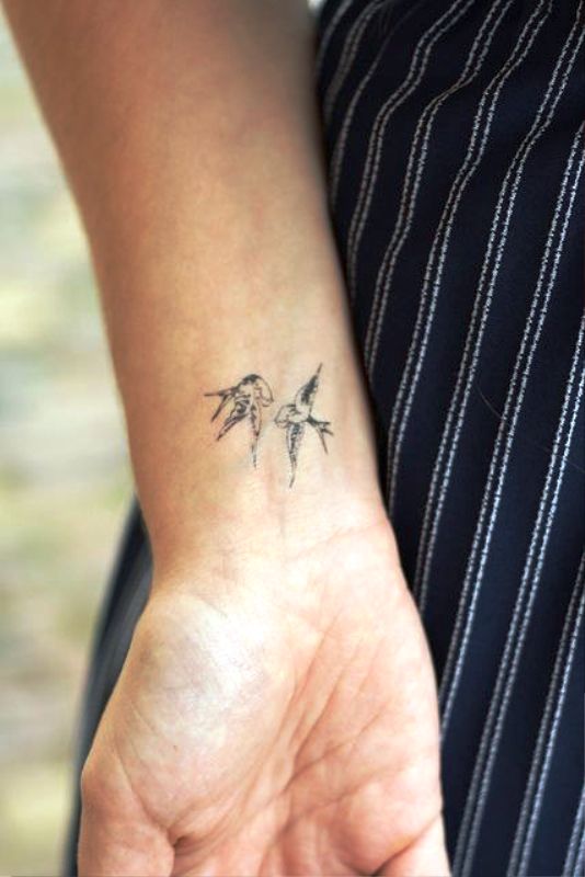 Two Beautiful Flying Birds Tattoo