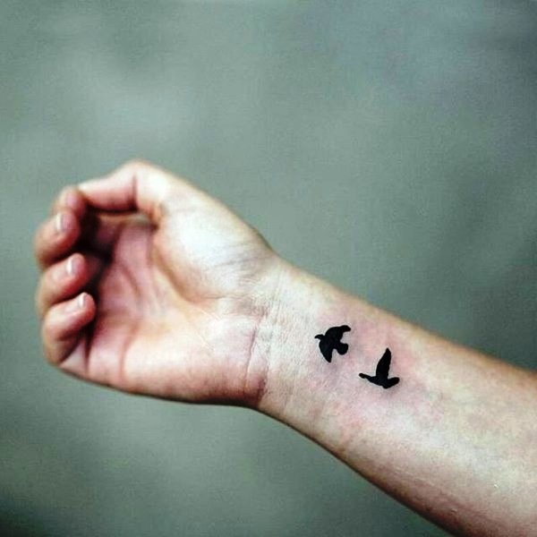 Two Flying Birds Tattoo On Wrist