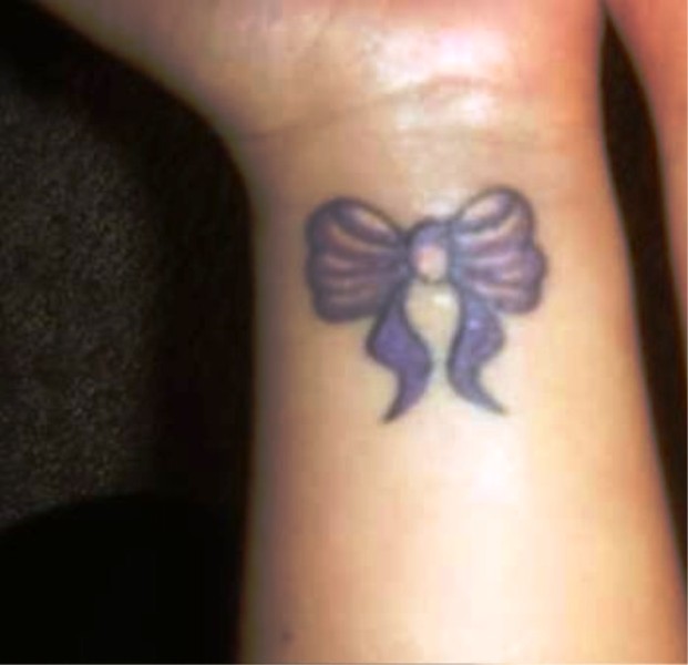 Two Purple Tattoos On Both Wrist