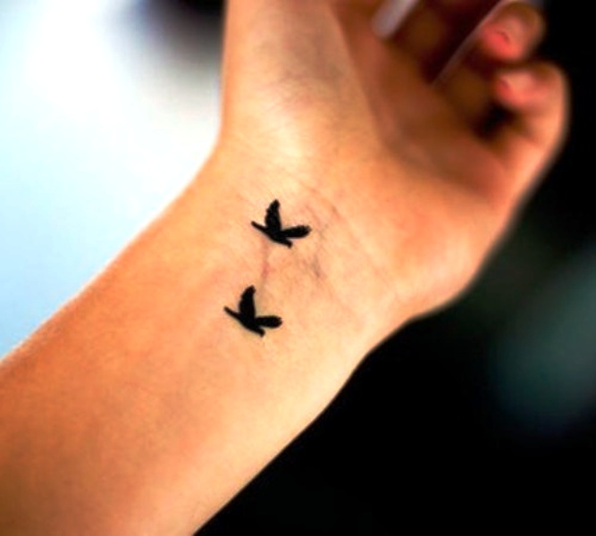 Two Tiny Birds Tattoo Design