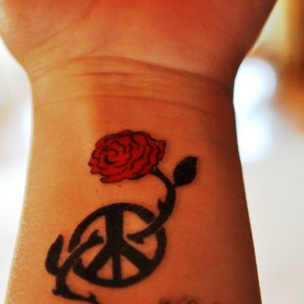 Wheel And Rose Tattoo On Wrist