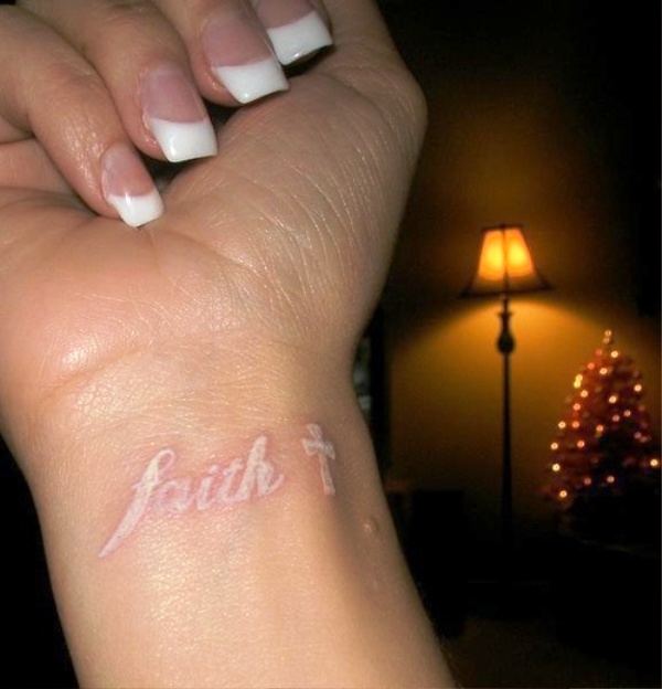 White Faith Tattoo On Wrist