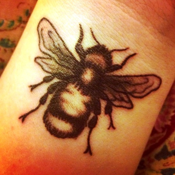 Wonderful Black Bee Tattoo On Wrist