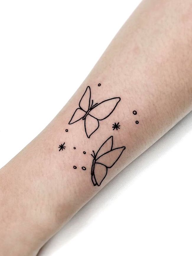 Butterfly-outline-wrist-tattoo-by-@tattooist_mauve
