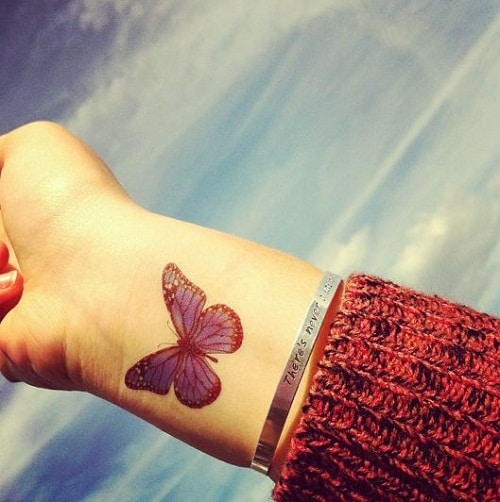 blue-butterfly-on-wrist-tattoo