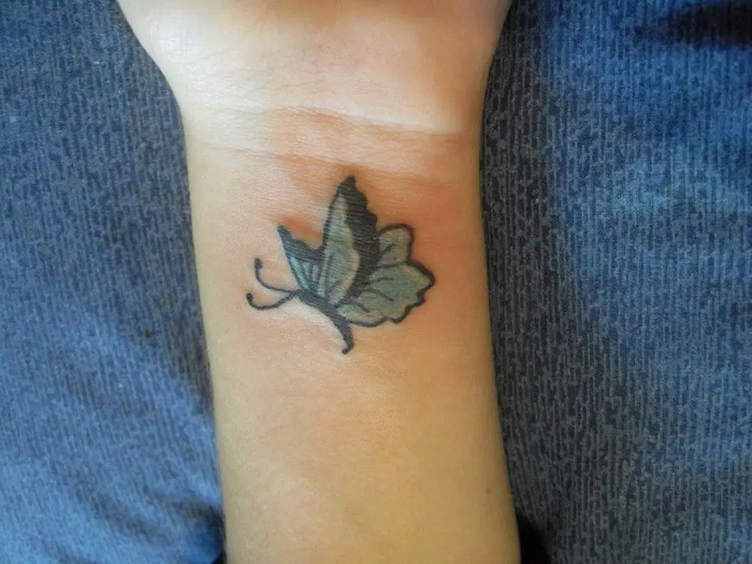 blue-butterfly-wrist-tattoo-design-for-women-female-YcuPe